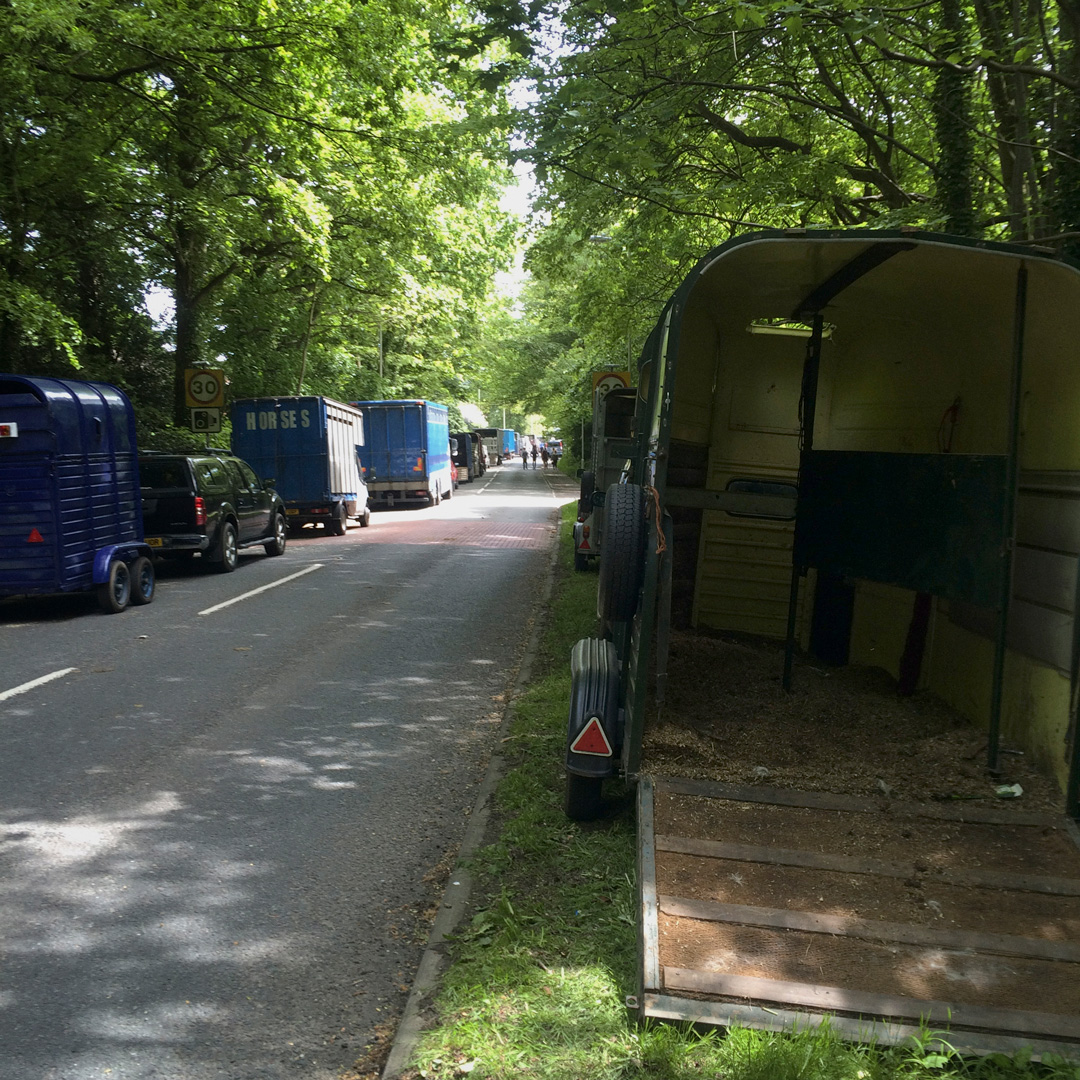 horse trailers on tree lined street wickham horsefair hampshire