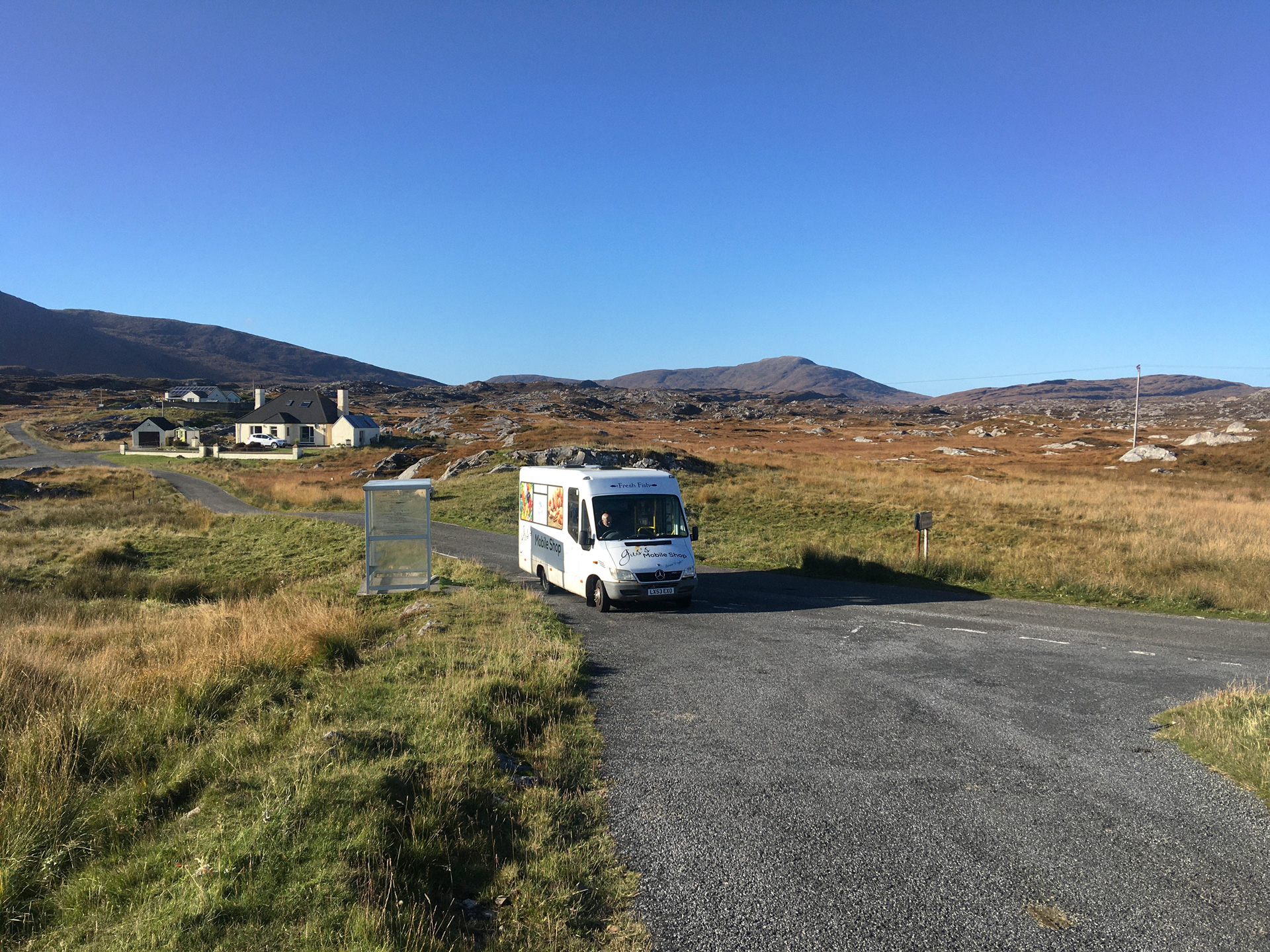 gus driving mobile shop countryside blue sky isle of harris outer hebrides