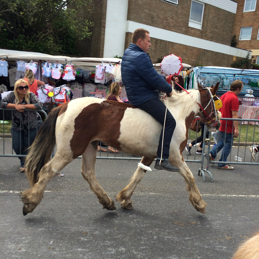 man riding horse street wickham horsefair