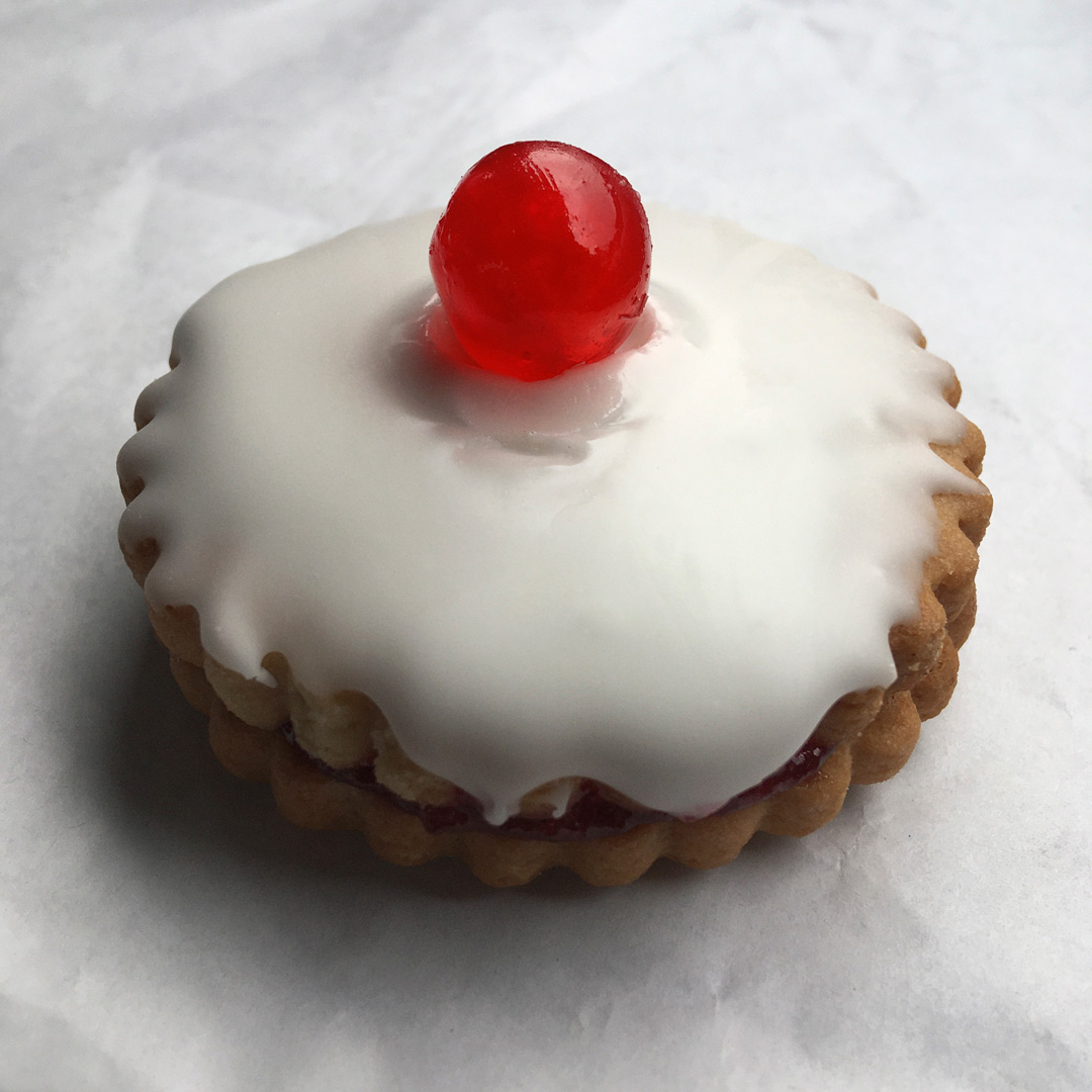 close up empire biscuit with icing and cherry moffatt scotland