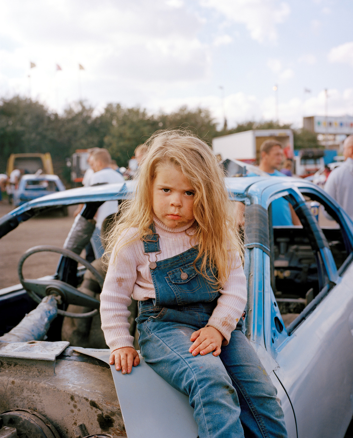 young girl dungarees sitting banger car foxhall stadium